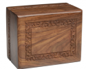 Suitable for use with the textured flat black polypropylene temporary container measuring 8 5/16″ H x 6 3/8″ W x 4 1/2″ D

Simple yet elegant hand-carved rosewood sheesham urn. Made from solid rosewood. Secure closure with slide out base. Beautifully made.

Available in Extra Small, Small, Medium, Adult Size, and TC (Temporary Container).