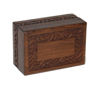 Slightly different than our original Rosewood Border urn, this model is offered at a very reasonable price.

Simple yet elegant hand-carved rosewood sheesham urn. Made from solid rosewood. Secure closure with slide out base. Beautifully made.

Available in Extra Small, Small, Medium