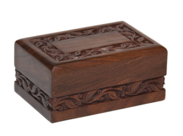 Slightly different than our original Rosewood Border urn, this model is offered at a very reasonable price.

Simple yet elegant hand-carved rosewood sheesham urn. Made from solid rosewood. Secure closure with slide-out base. Beautifully made.

Available in Extra Small, Small, Medium