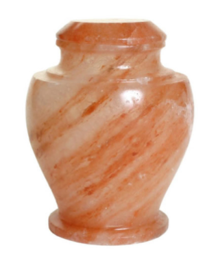 The Carpel Rock Salt urn is a full-capacity urn that is a perfect vessel for a natural disposition. It’s a 100% bio-degradable urn made out of natural Rock Salt. Designed for sea burials or water funerals; guaranteed to dissolve in four hours.

This urn has a natural color of many shades of red and orange with slight white/clear highlights.

Each urn is made from one block of stone and not pieced together; this helps to prevent the urn from cracking and allows the urn to be seamless. The matching lid opens from the top and can be sealed permanently when ready.

Each urn takes 5 hours to be manufactured, making each urn a true piece of art. Pricing: $395 includes shipping. 