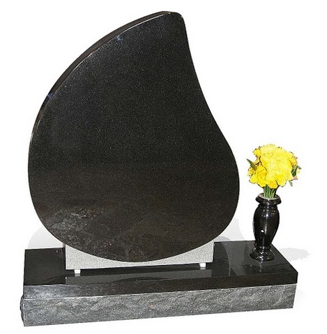 Geometric shape with a flower vase decorate this single upright monument.