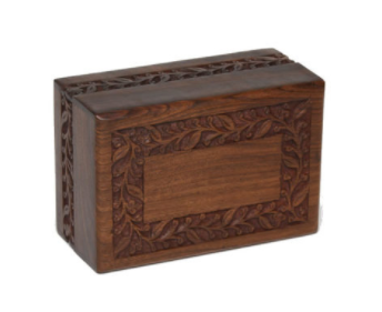 Slightly different than our original Rosewood Border urn, this model is offered at a very reasonable price.

Simple yet elegant hand-carved rosewood sheesham urn. Made from solid rosewood. Secure closure with slide-out base. Beautifully made.

Available in Extra Small, Small, Medium